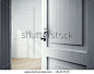 opened door in gray room - stock photo
