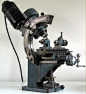 Looks like a gear cutting mill, I haven't seen one so just guessing: 