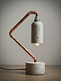 Concrete and brass lamp.: 