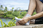 Jogger massaging the metatarsal area of the foot