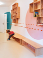Love the simple white walls with circles of color, simple benches, hooks Kita Hisa - nach dem Umbau: 