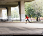 African American runner jogging on sidewalk - stock photo