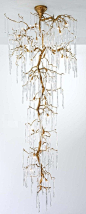 Glamour staircase chandelier by Serip made up of handcrafted bronze and handblown glass. uploaded by user-- no source.