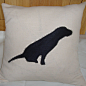 Appliqué Cushion : This Oscar cushion, inspired by a real Labrador puppy, combines a pale sand coloured linen with a silky, slubby appliqué panel in black on the front. The reverse is the same plain linen.  

The cushion is approximately 40cm square, zipp