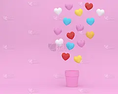 以五彩缤纷的心形浮子与粉红色背景上的花盆为创意布局。爱和情人节的最小概念