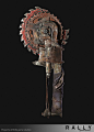 This may contain: an old metal mask is hanging on the wall