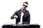 Trendy male dj posing against mixing console