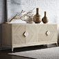 PALECEK SLOANE SIDEBOARD Sideboard features pencil pole rattan hand-set in a diamond shaped design with a hardwood frame and legs all in a white wash finish accented with fossilized clam handles. Three inside compartments include adjustable shelves.