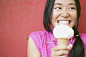 Young woman enjoying an ice cream cone - stock photo