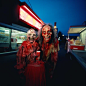 David Lachapelle and Terr Richardson and PrettyPuke photo of a demonic, haggard, old, hideous witch covered in red paint and burger beef smiling outside of a 7 eleven, high flash, eerie, beautiful, wondrous, fairytale, magic, psychedelic, Telecine 2001, F