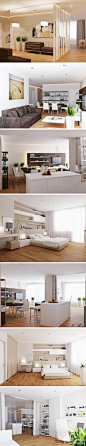 白色的墙壁，柔和的线条美，一个开放式的起居空间，宽敞舒适