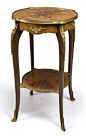 A Louis XV style gilt bronze mounted kingwood and satinwood marquetry gueridon circa 1900