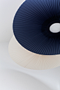 CARMEN — PAULINEPLUSLUIS : C A R M E N Hartô, 2018 Carmen is a ceiling lamp made of a pleated fabric corolla that surrounds a luminous disc. The pleated fabric is used for its...