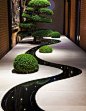 wow love this contemporary indoor garden! stunning reflection of lights and planting in the dark dyed water feature