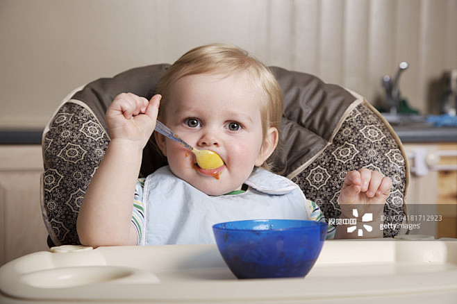 Boy Eating with Spoo...