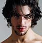 Guy With Black Hair And Green Eyes Photo