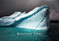 This may contain: an iceberg floating in the ocean on a cloudy day with dark clouds above it