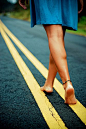 barefoot on a road.: 