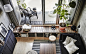 A grey and black living room with patio and French windows.