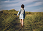 Young girl walking on a trail to the beach. by Ramón  Espelt on 500px