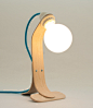 Table lamp made in curved solid chestnut wood : Table or desk lamp made ​​of solid chestnut wood curved through the traditional technique of steam bending. Lamp base in a natural, simple, clean and timeless nordic style, mixed with a white balloon lightbu