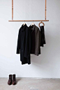 PE COATRACK  Featuring a carved ring to hold scarves and umbrellas and crafted from solid Oak, the ‘Pe’ Coatrack by young German designer Florian Saul is suspended from the ceiling by beautifully hand-crafted leather belts.