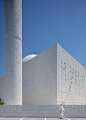 reinterpreted islamic patterns and triangulated geometry clad mosque in UAE