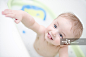 Baby in Bathtub sticking out Tongue_创意图片