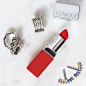 New on #TheWink: Matte red #lipstick + silver jewelry = Rocker Chic. “Silver accessories and red lipstick has such a rock-and-roll vibe—it’s bold and confident,” says London-based jeweler @ByAlona. Try #CliniquePop Matte Lip Colour + Primer in Ruby Pop wi