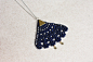 Pendant geometric necklace in blue lace with brass triangle