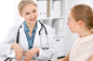 Doctor and  patient  sitting at the desk