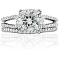 Monique Lhuillier Halo Diamond Engagement Ring in Platinum  | Blue Nile : Undeniably striking, this platinum engagement ring showcases a dramatic depth of pavé-set diamonds arranged in a halo and split shank design that reflect pure sophistication.