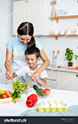 stock-photo-bonding-concept-cheerful-mother-helping-her-son-to-cook-teaching-little-boy-how-to-prepare-2018848514