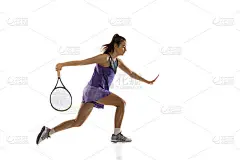 年轻的白人女子打网球孤立在白色工作室背景在行动和运动，运动概念