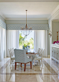 Example of a beach style dining room design in Miami with blue walls