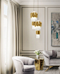 Empire Pendant | Hotel Lobby | LUXXU Modern Lamps | One of our main gold is our Empire Pendant, inspired in the stunning architectural building, the Empire State Building. #modernlamps #modernchandelier #luxurychandelier See more: http://www.luxxu.net/pro