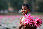 Cambodian kid and his lotus by Aaron Gao on 500px