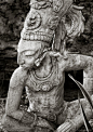 Statue of an ancient Mayan warrior in a jungle setting in Mexico’s Riviera Maya region. © David A. Kamm
