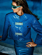 Dressed in blue, Gisele Bundchen models Chanel jacket with Atsuko Kudo latex robe and Pierre Cardin sunglasses