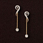 Long chain dangling earrings. 14K yellow gold and diamond