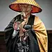 Japanese Monk Waiting patiently on the uphill walk to the Kiyomizudera Temple in Kyoto. Japan: 