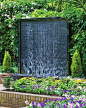 Petal wall water feature as the decorative feature of a garden