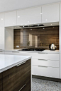 clear glass over timber veneer splashback