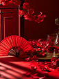 桌子上放着一把红色的折扇，旁边放着几颗红梅，背景比较模糊，好像在举行婚礼。中国的新年海报创造了一个独特的场景。春节气氛，喜庆，特写，高端，静物拍摄--ar 34-v 6 (9)