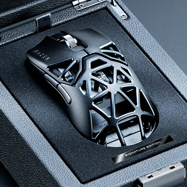 This may contain: a computer mouse sitting on top of a black box in a ...