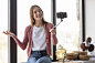 young-blogger-recording-herself-window