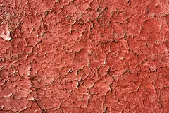 红色油漆开裂，有锈。无缝旧纹理背景