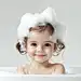 aeyhykk_A_little_girl_is_in_the_bathtub_her_hair_covered_with_s_0cb755e2-3d27-4054-a261-28854c95be7c