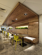 Coffee Shop Design | Retail Design | Cafe seating : beautiful wood. great idea for the plants