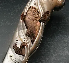 This may contain: a metal object with a fish on it